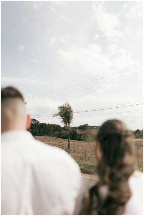 A couple gazing at a peaceful countryside landscap