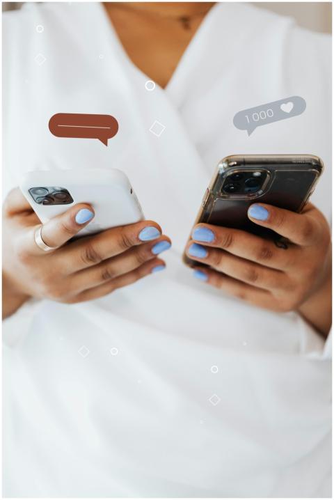 Close-up of person holding two smartphones, symbol