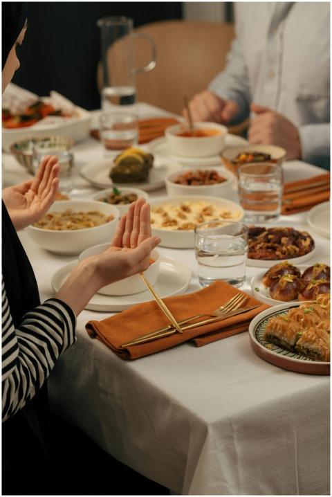 A family prays before enjoying a traditional Ramad