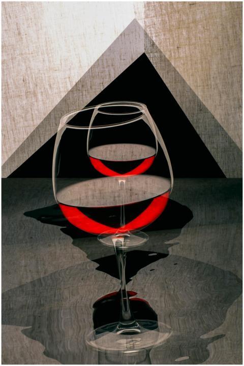 Abstract photo of wine glasses with a red liquid r