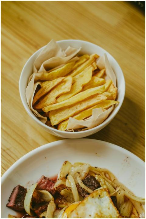 Crispy homemade french fries served in a bowl on a