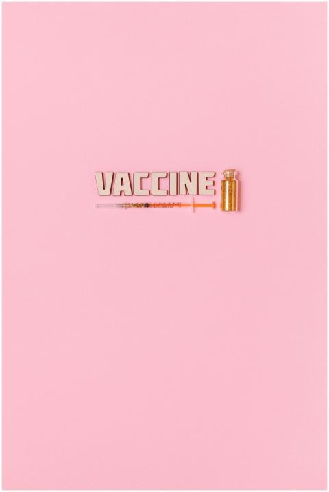 Conceptual image of vaccine text, syringe, and via