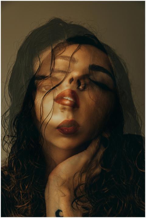 Artistic double exposure portrait of a woman expre