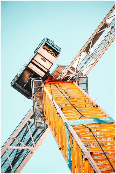 A striking low angle shot of a vibrant yellow towe