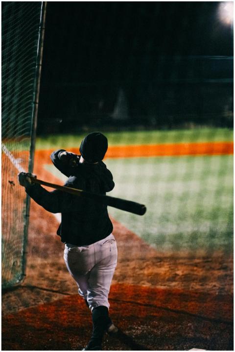Baseball player in action swinging a bat during a