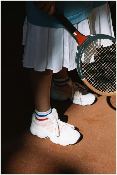 Close-up of a tennis player holding a racket, show