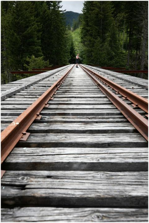 Low-angle view of wooden train tracks stretching t
