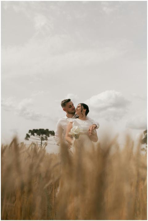 A couple romantically embracing in a wheat field u