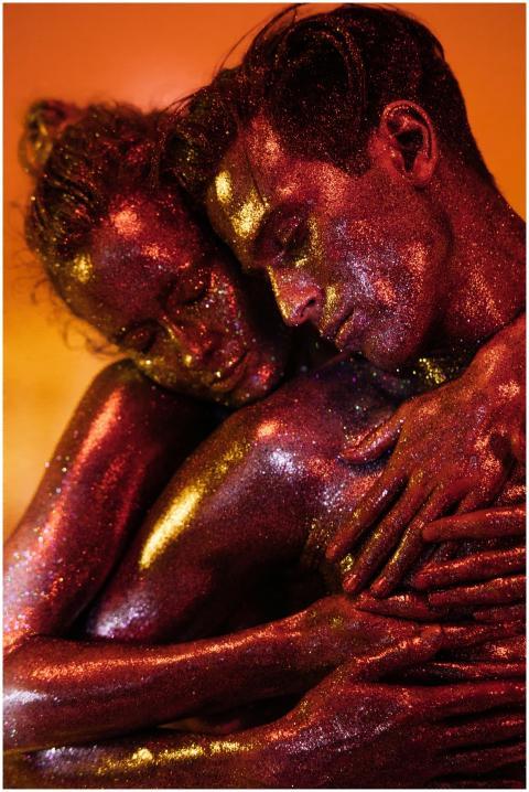 A captivating shot of two models embracing with gl