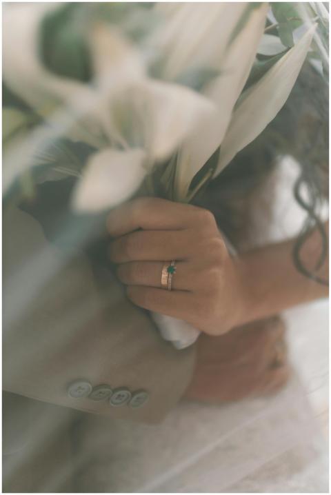 Close-up of a bride holding a bouquet, showcasing