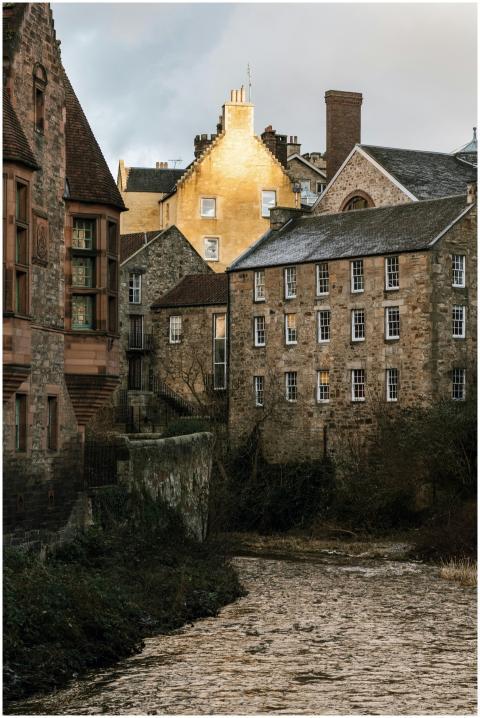 Charming view of historic stone buildings by a riv