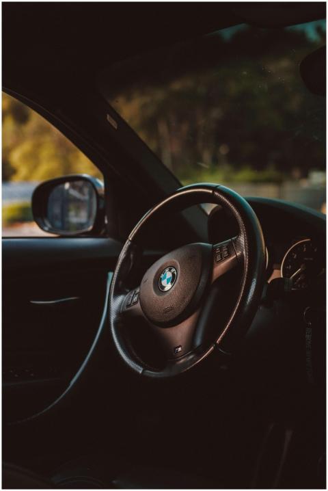 Elegant interior of a BMW showcasing luxury steeri