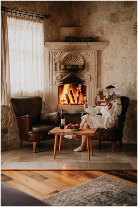 A cozy relaxation spot by the fireplace in a Turki