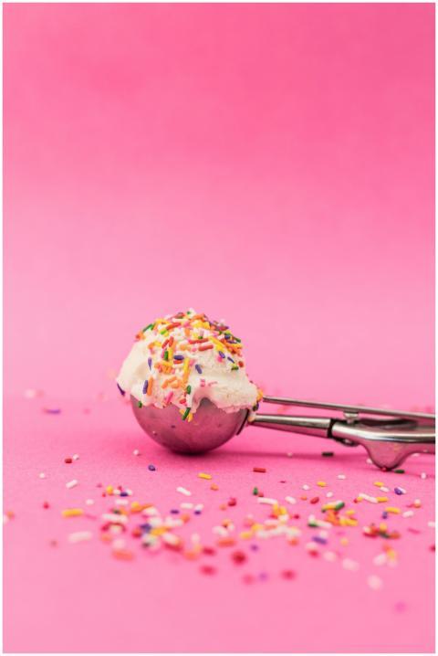 Close-up of a vanilla ice cream scoop in a metal s