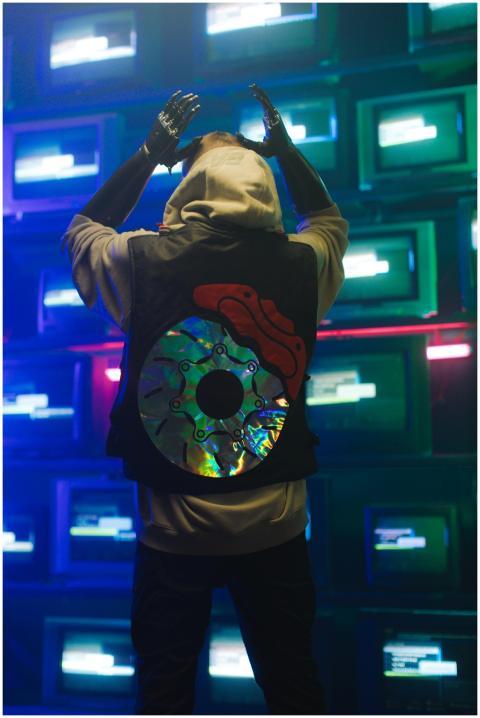 Cyberpunk-themed image of a cyborg in neon-lit roo