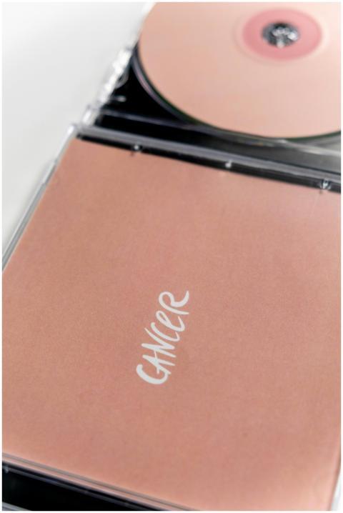 Close-up of pink CD case promoting cancer awarenes