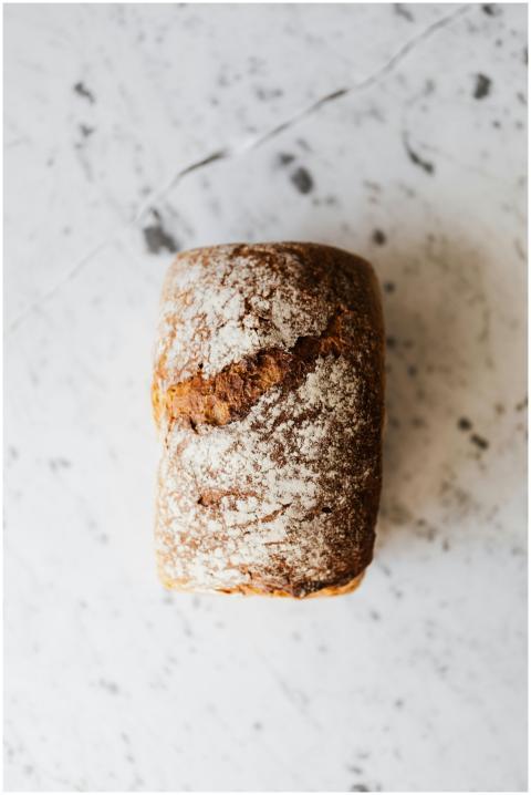 Top view of small rectangular baked bread loaf wit