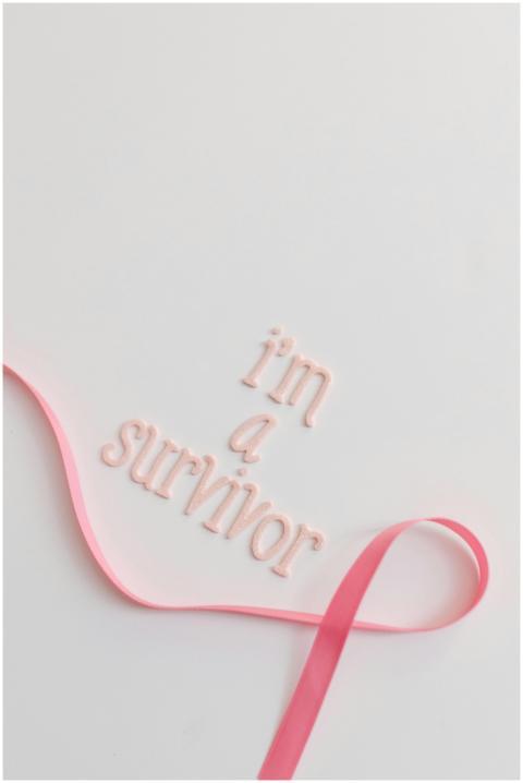 Empowering cancer survivor message with pink ribbo