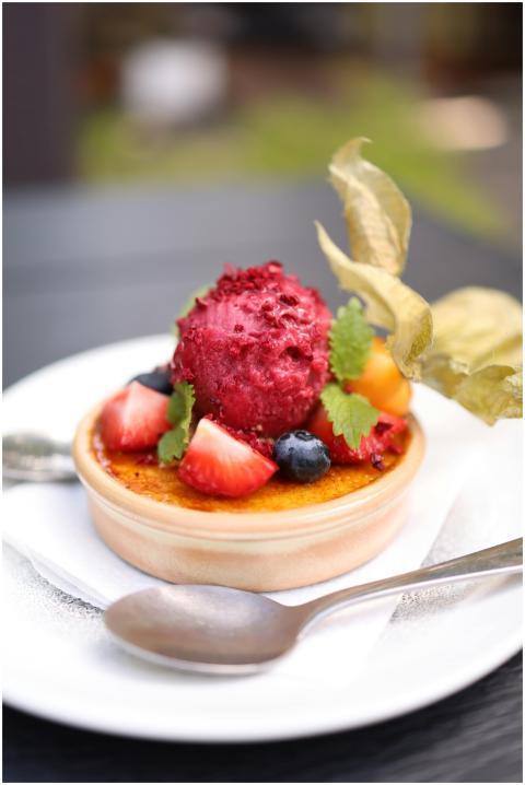 A close-up of a vibrant fruit-topped dessert with
