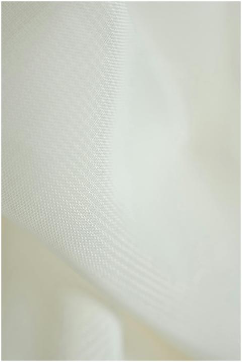 Close-up of a smooth white woven fabric texture, i