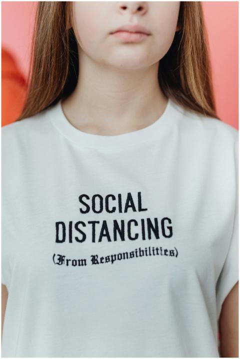 Close-up of white T-shirt with embroidered funny s