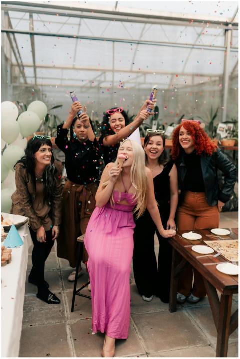 Group of women enjoying a festive birthday party w