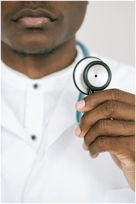 Doctor holding a stethoscope in close-up, showcasi