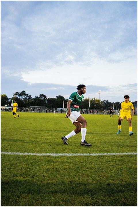 Athletes in action during a competitive soccer mat