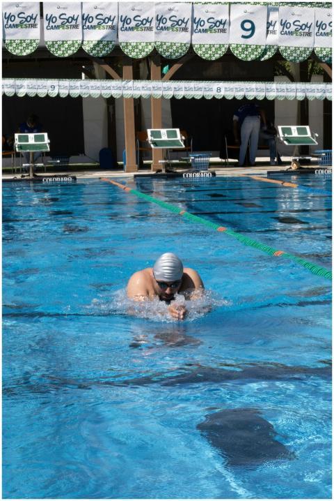 An athlete competes in a swimming pool in Aguascal