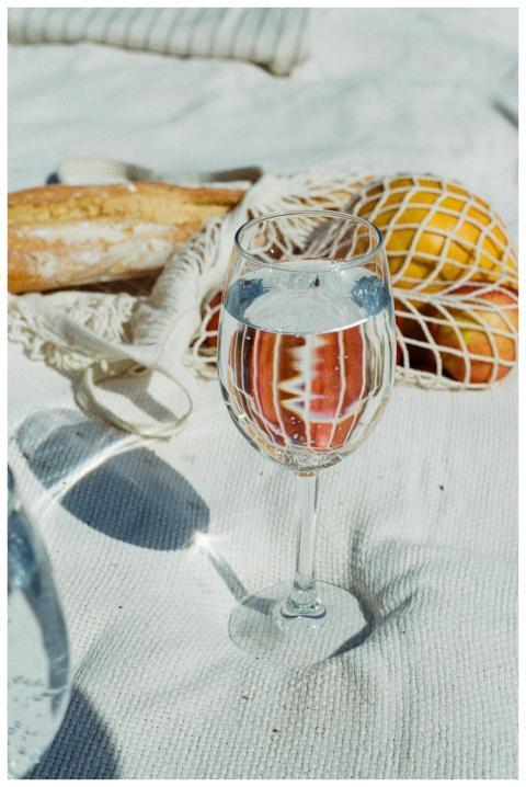 A close-up of a refreshing outdoor picnic setup wi