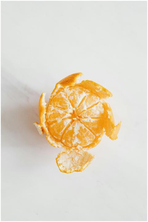 Top view of a peeled tangerine creating a natural