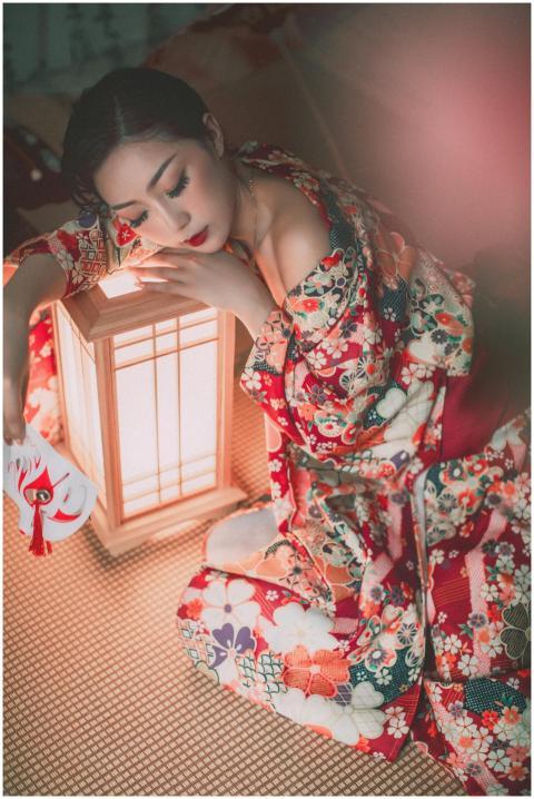 Artistic portrait of a woman in a colorful kimono,