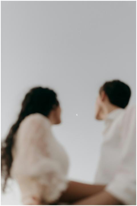 Abstract silhouette of a couple looking at a cresc