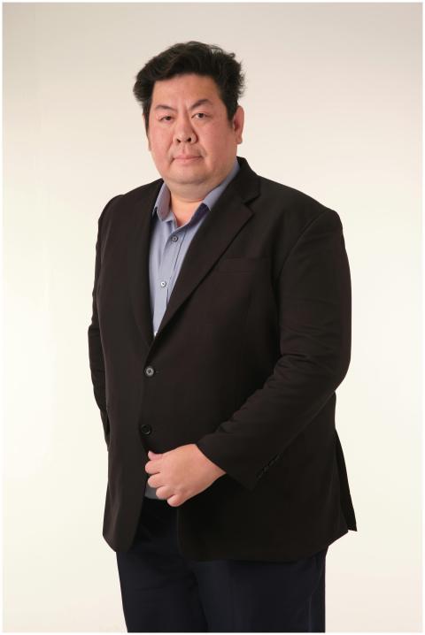 Formal portrait of a businessman in a suit against