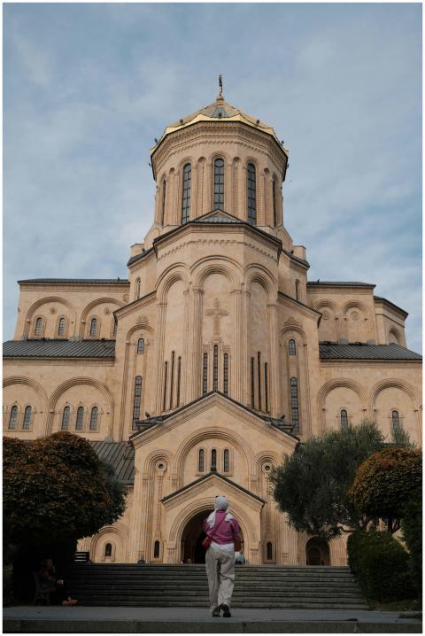 Person walking towards Holy Trinity Cathedral in T