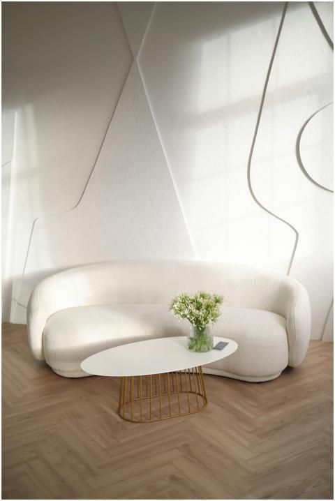 Elegant living room with a sleek white sofa, styli