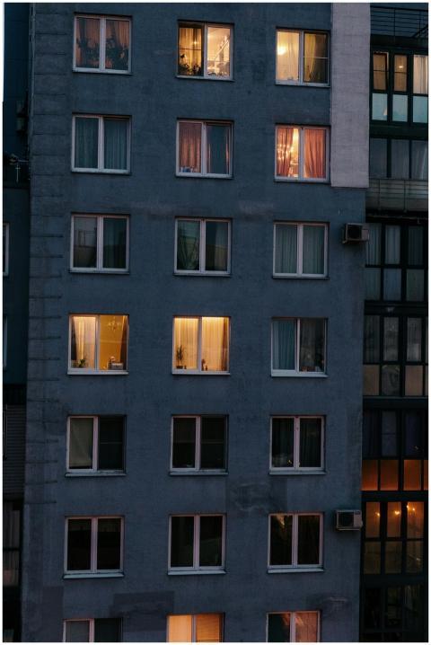 View of an urban high-rise building at night with