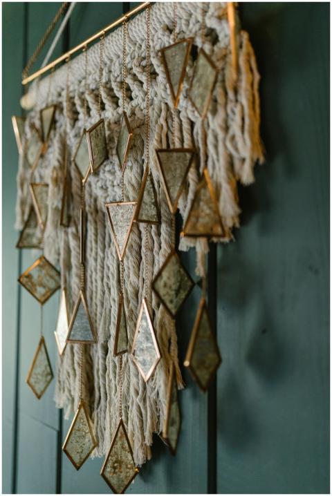Detailed macrame wall hanging with geometric mirro