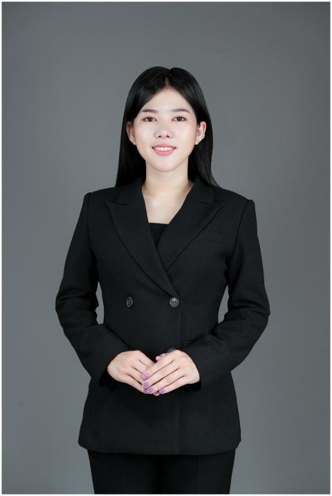 Confident Asian businesswoman in a suit smiling du