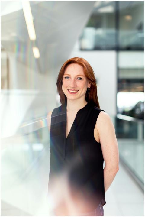 Confident businesswoman smiling in a bright modern