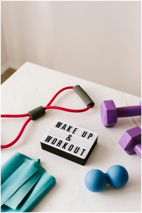 From above composition of dumbbells and massage do