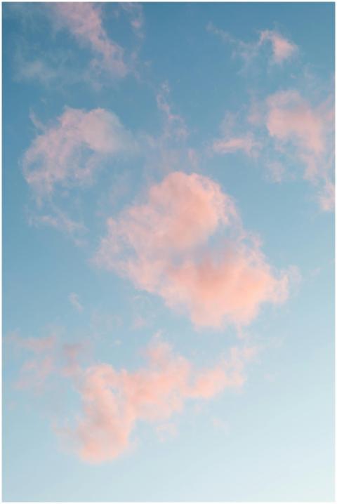 Beautiful view of soft pink clouds against a clear