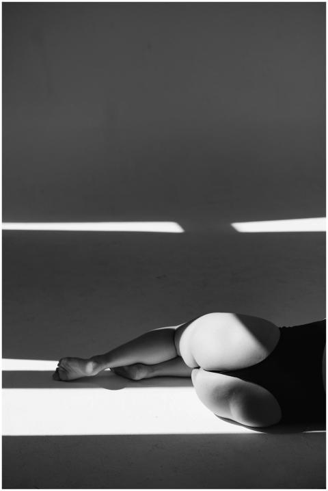 Artistic black and white photo of a woman resting