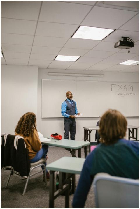 Professor giving a lecture to diverse students in