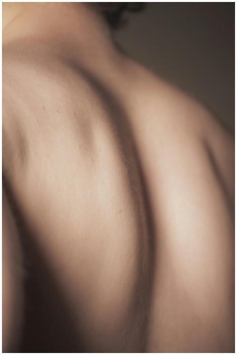 Elegant close-up of human back showing shoulder bl