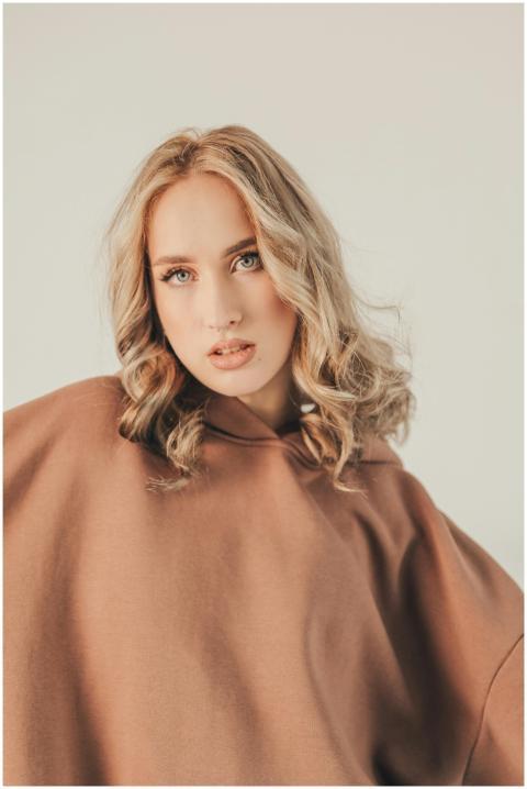 Elegant portrait featuring a blonde woman wearing