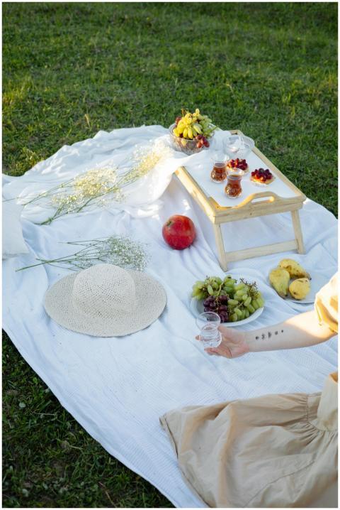Enjoy a serene outdoor picnic with fresh fruits an