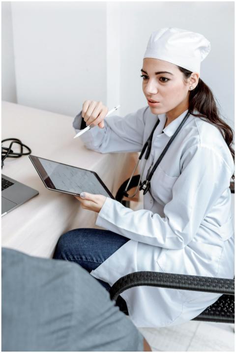 Female doctor discussing results with patient usin