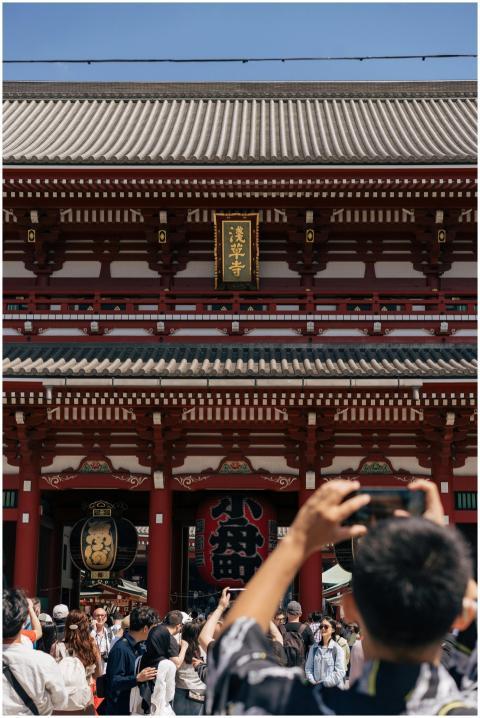 Tourists gather at the historic Senso-ji Temple in