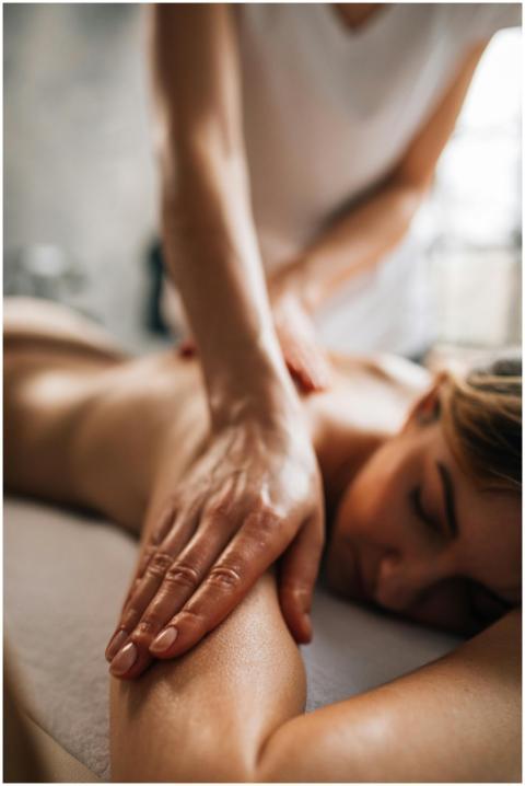 A woman enjoying a relaxing massage in a serene sp